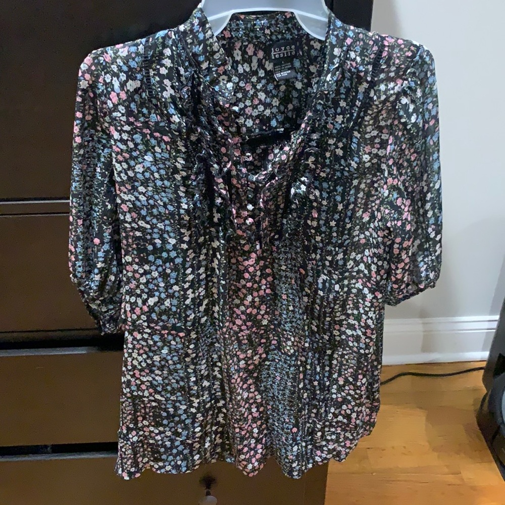 Black floral sheer top with buttons and ruffles
